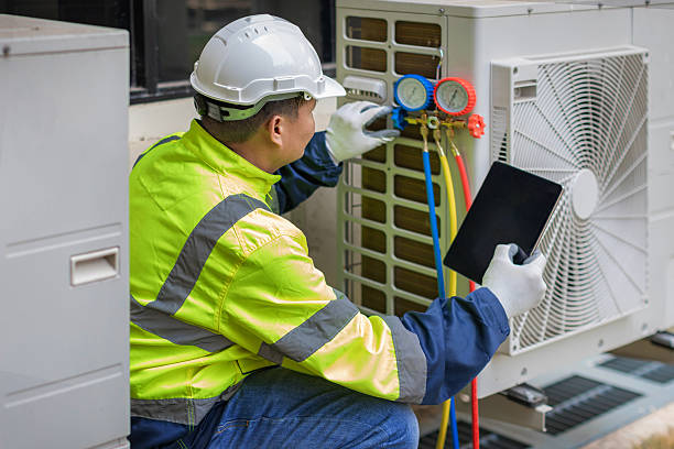 Professional Heat Pump Repair technician working in Conception Junction, MO